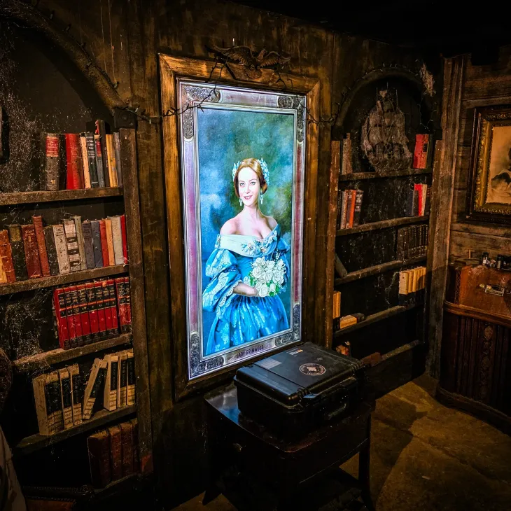 Glowing portrait and investigator's case inside Grimwood Hall